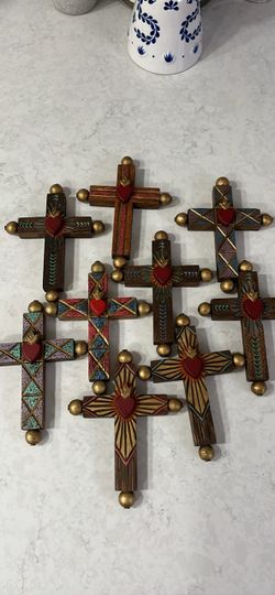 Hand-Painted Wooden Sacred Heart crosses . Each one is $35 dollars.