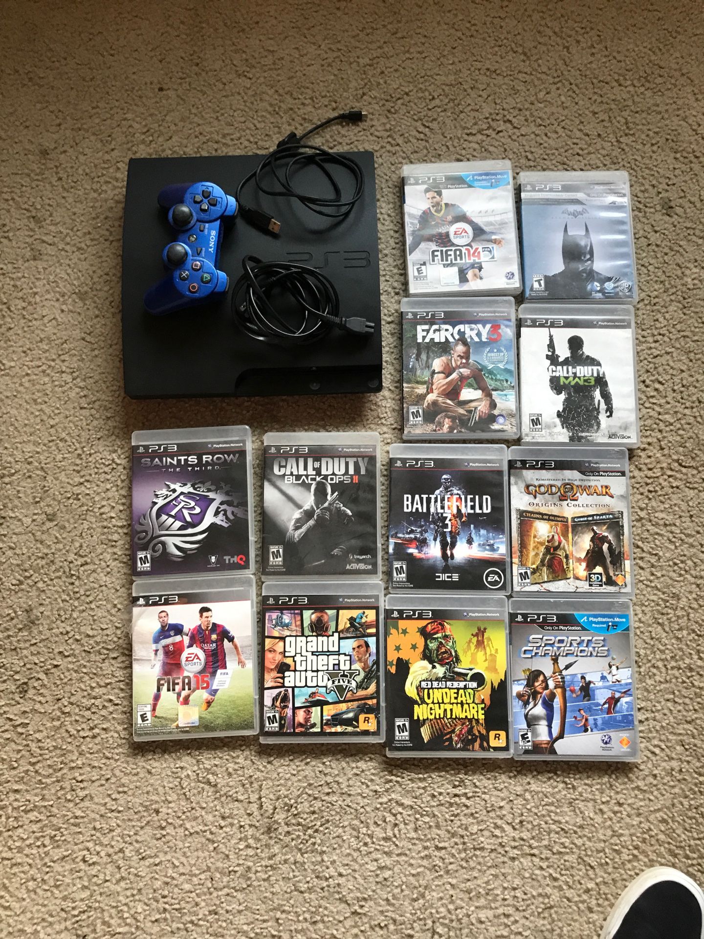 PS3 with games and controller