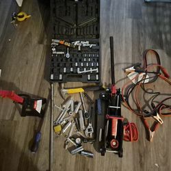 Mixed tools breaker bar, car jack and a stand