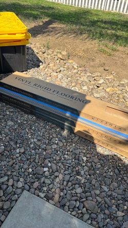 3 boxes of vinyl rigid flooring