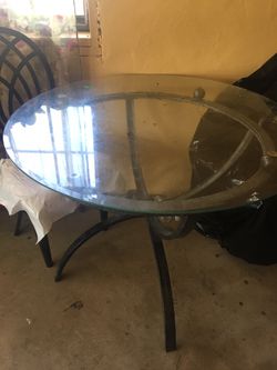 Glass table w/ 4 metals chairs