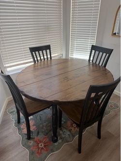 Sturdy wood table with 4 slate back chairs