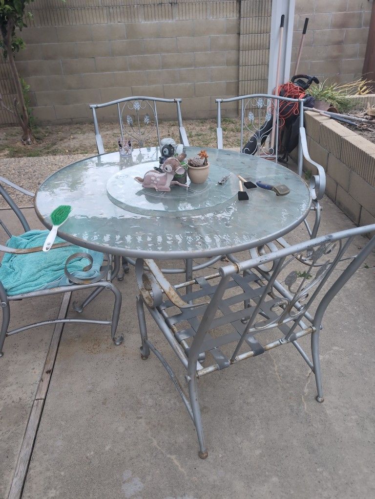 Patio Chairs And Glass Table. No Cushions Has Some Rust.