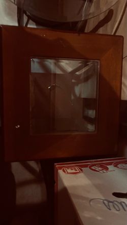 Wooden end table with glass center and bottom shelf