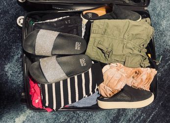 Suitcase full of clothes + living proof conditioner