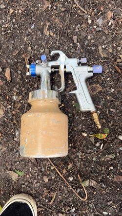 Paint gun and sprayer