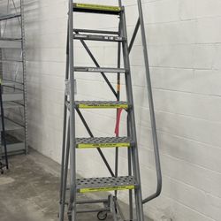 Industrial rolling stairs and shelving available