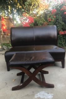 Leather love seat with foot rest