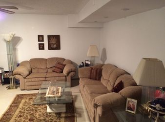 Two Sofas With Four Recliners, 3 Lamps, 3 Glass Tables