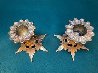 Antique very pretty solid brass candlestick holders with floral shapes top and star base