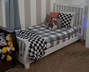 White twin bed frame with mattress and boxspring
