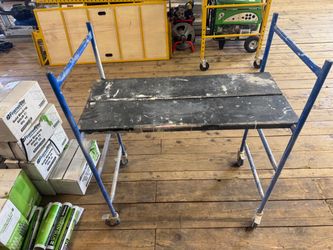 Mini rolling scaffolding.
