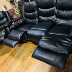 two pieces of black leather recliners