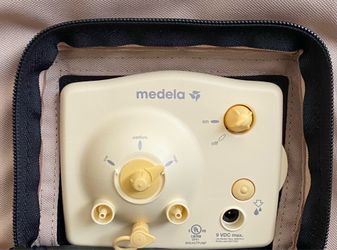 Medella Breast pump with accessories