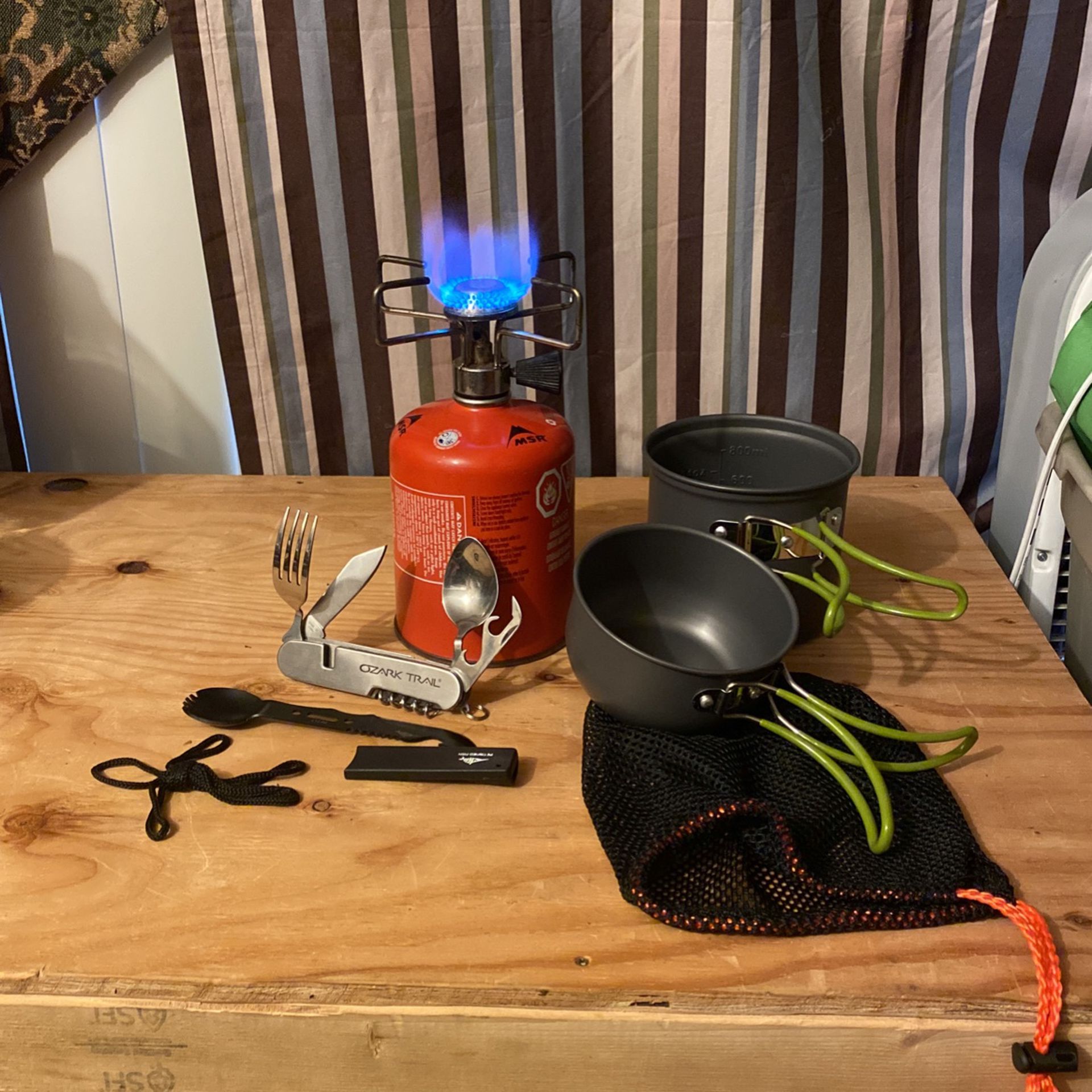 Backpacking stove,pots, fuel, forks, and spoons.