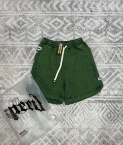 Green godspeed shorts with white text on side
