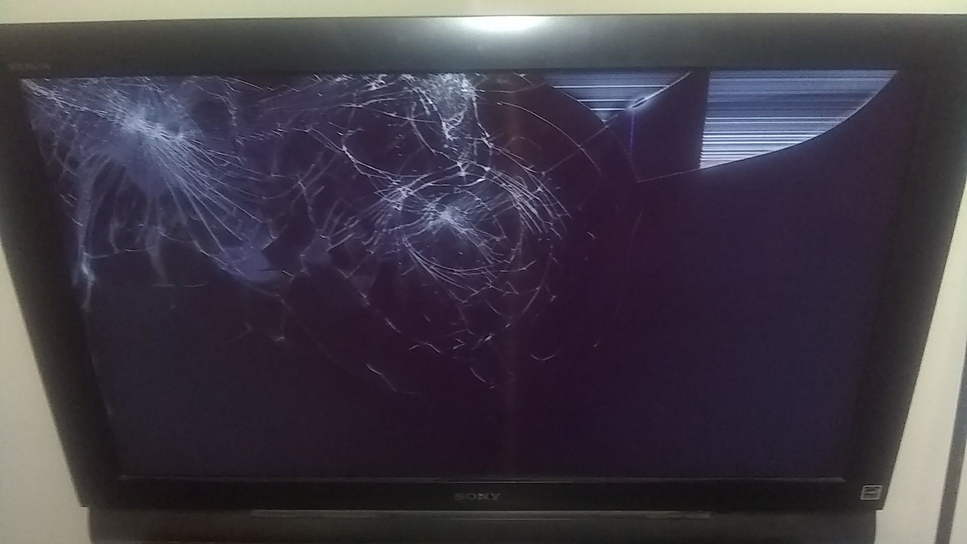 Busted up 37" big screen TV, Sony Bravia.