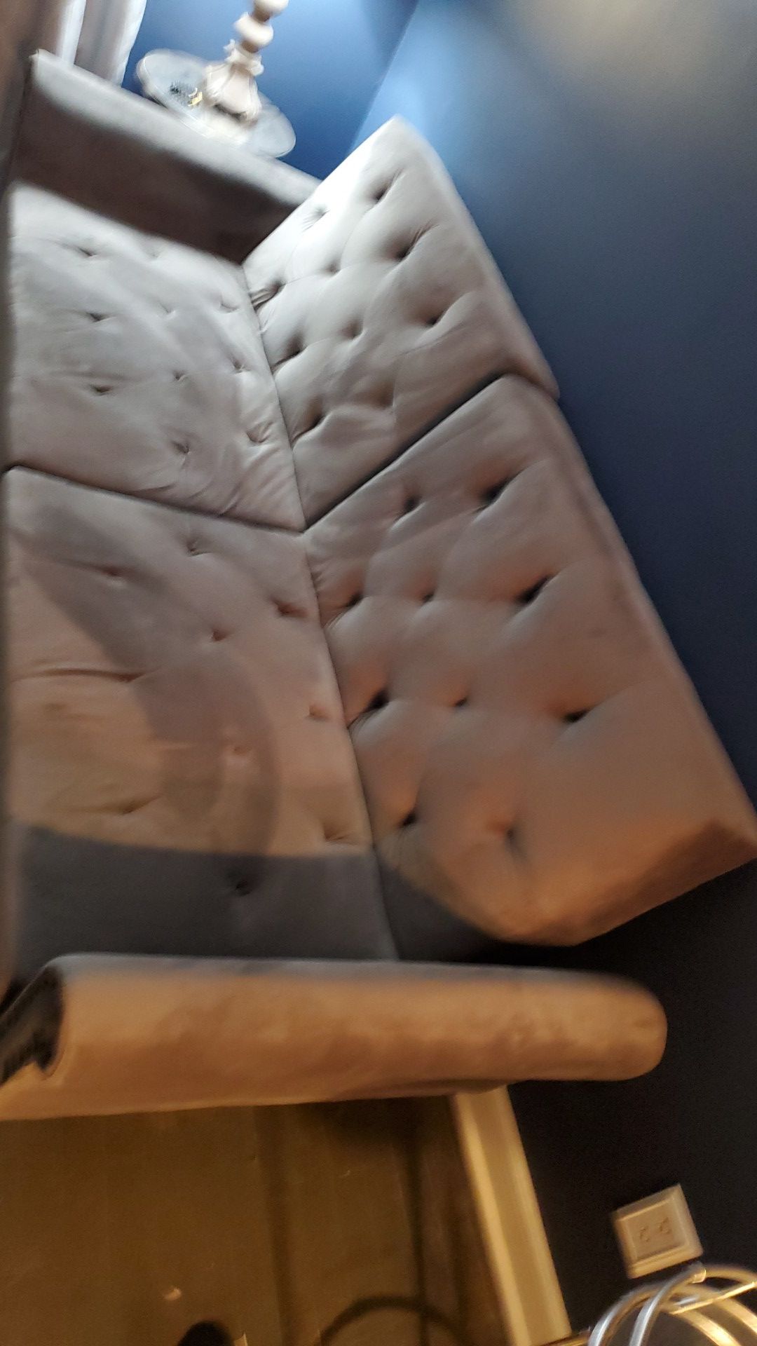 Gray velour sofa