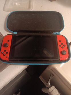 Nintendo Switch with Red Joy-Cons and Carry Case
