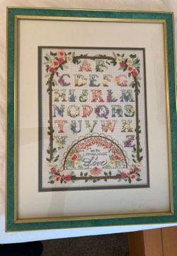 Cross-stitched floral artwork
