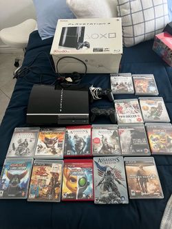 Playstation 3 with box and games