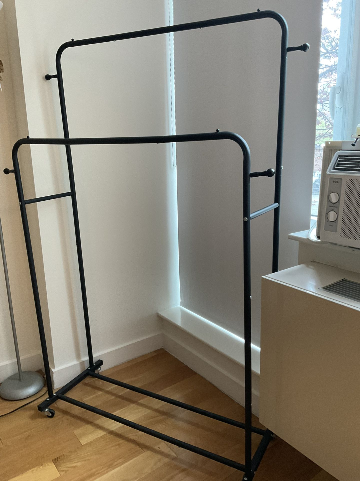 clothing rack with hanging hooks and wheels