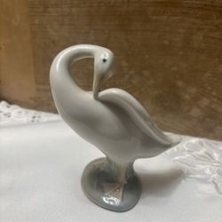 retired Lladro porcelain figurine, likely a preening goose or duck,