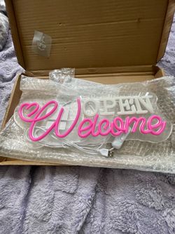 “Welcome open” sign