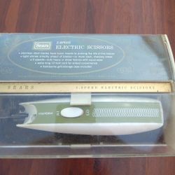 Vintage Sears Electric Sewing Fabric Scissors 2 Speed. These sell on e Bay for $29.99