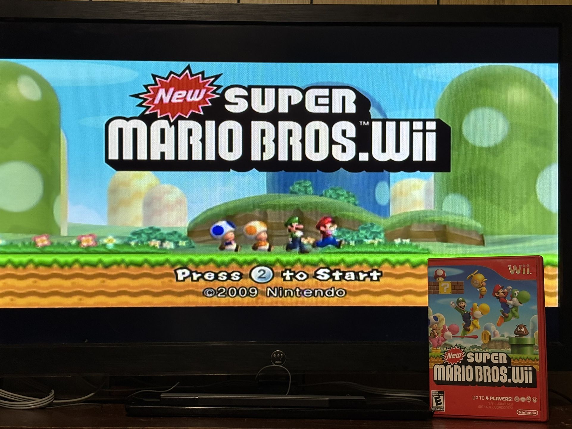 Nintendo Wii Bundle - 2 Remotes + Wii MotionPlus + Super Mario Bros + Wii Resort
