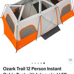 Ozark Trail 12 Person Instant Cabin Tent with Integrated LED Lights, 3 Rooms
, CHECK THE PICTURES IT HAD A FEW HOLED BUT RAIN FLY CAN COVER IT 
