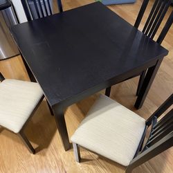 Black Dining Table with built-in expanding sections 4 Chairs 