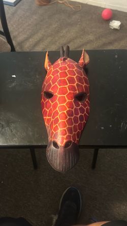 Hand-carved wooden African giraffe mask,