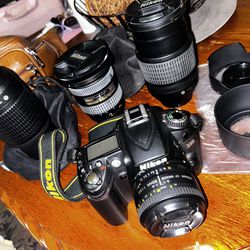 Nikon Camera With 4 Lenses 