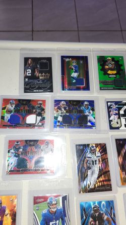 Sports cards..  Mainly NFL.. I Have Multiple of good rookies as u can see and under the card is more of same person. ALL ARE SLEEVED AND IN HARD COVER