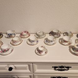 TEA CUPS AND SAUCERS