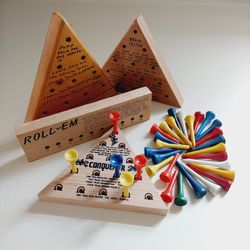Set of 4 Wooden Peg Board Puzzle Games and 31 Miscellaneous Multi-Colored Pegs for Play. Roll 'Em, Brain Tester, Conqueror & A Comical Jump the Peg Ga