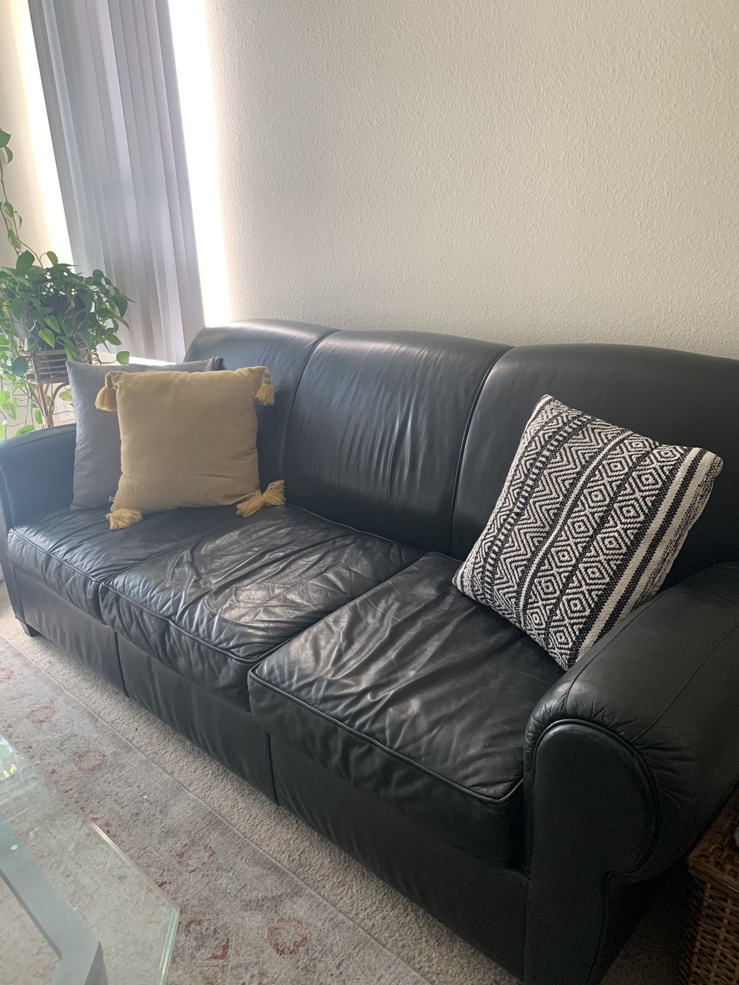 Black leather Pottery Barn sleeper sofa