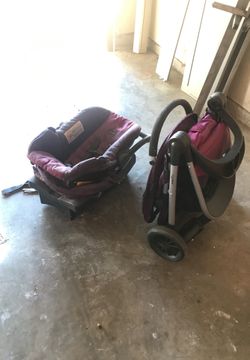 Pink and purple car seat base and stroller