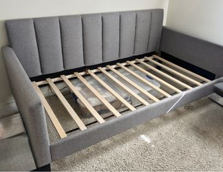 Gray upholstered twin daybed