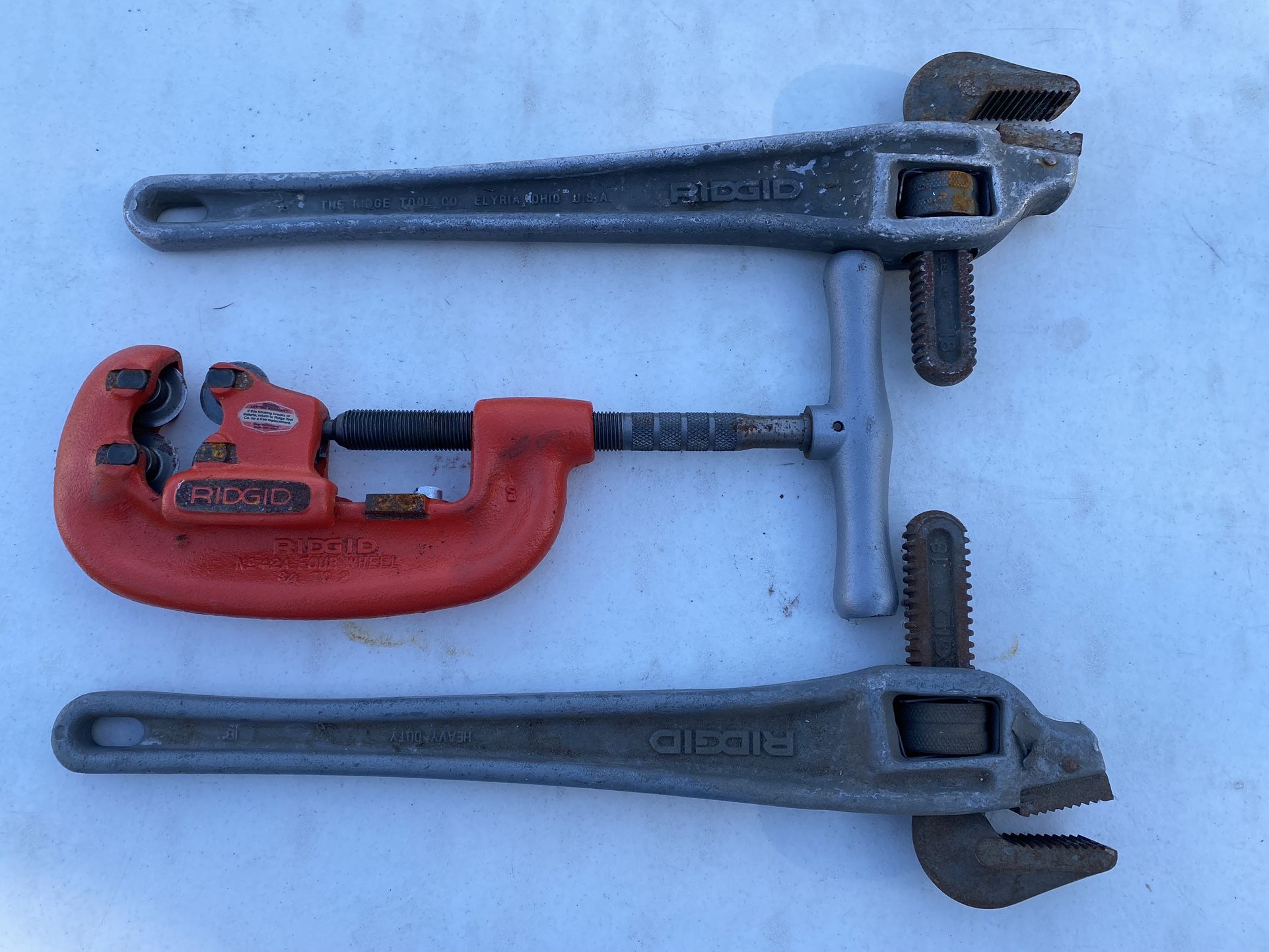 2 Ridgid 4-Wheel Pipe Cutter And Two Ridgid 18” Offset Aluminum Wrenches