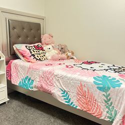 Grey twin bed with LED headboard