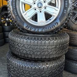 4 WHEELS AND TIRES FORD F-150  17 INCH with 255/70R17 GOOD YEAR WRANGLER TERRITORY AT   $800 INSTALLED 