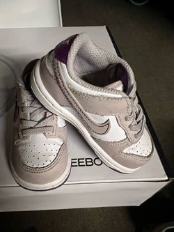Nike Dunk Low TD in the White/ Platinum Violet/Viotech colorway, designed in sizes for babies and toddlers (size 5.5).