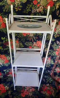 Foldable, solid metal, 3 shelf display stand.