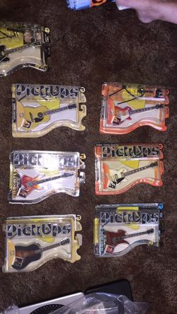 Ten assorted mini guitar pickups