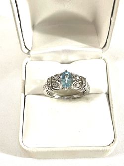 Brand new one of a kind .925 silver ring with aquamarine and CZ diamonds. Size 9.