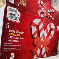 5 ft. Icicle Shimmer Twinkling LED Candy Canes Red Bow Holiday Yard Decoration