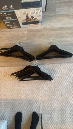 30- Set of Black Wooden Hangers