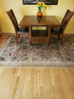 High end table with 4 chairs , had only several months paid 1200